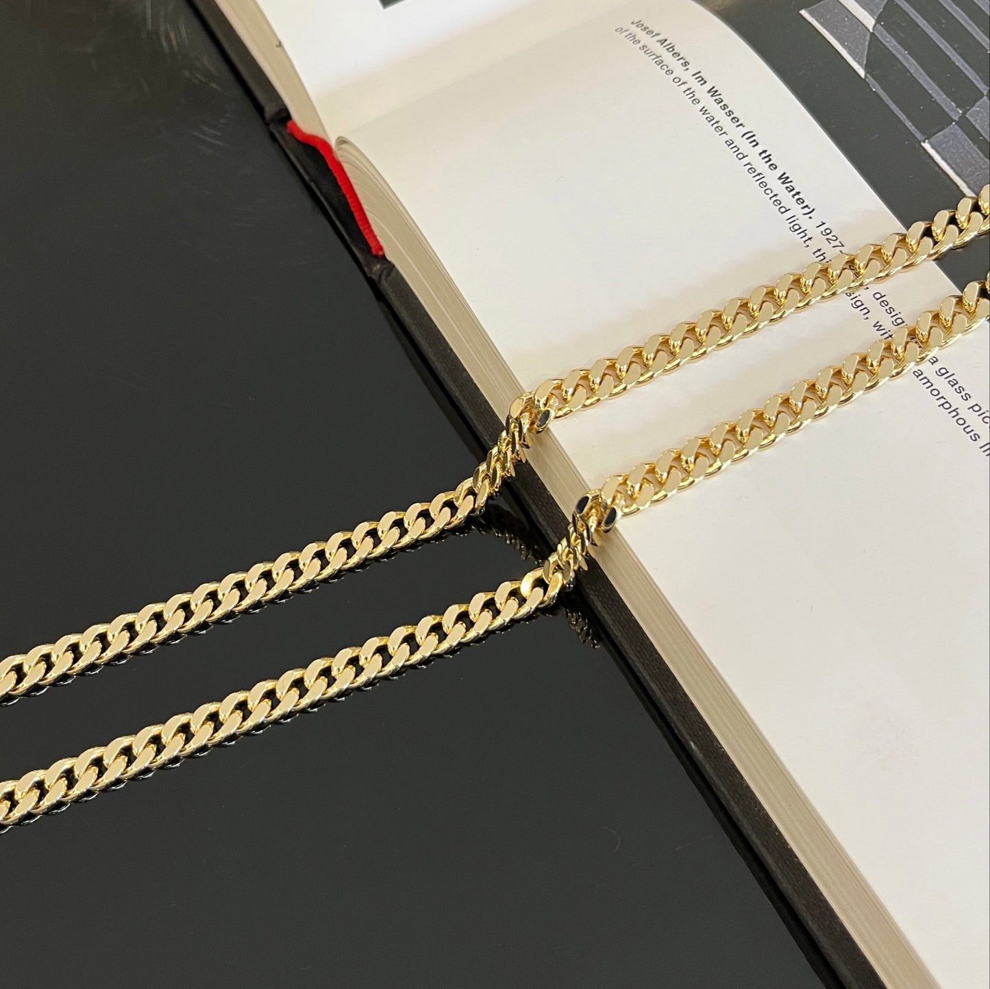 Gold chain on an open book