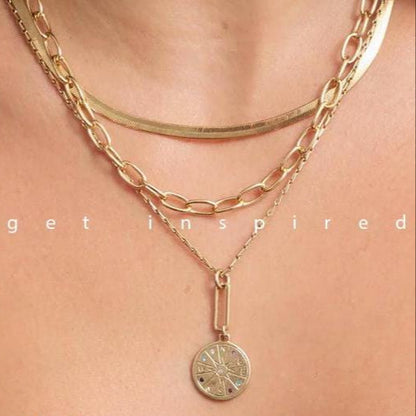 Gold chain necklace with a pendant on a person's neck, with 'get inspired' text overlay.