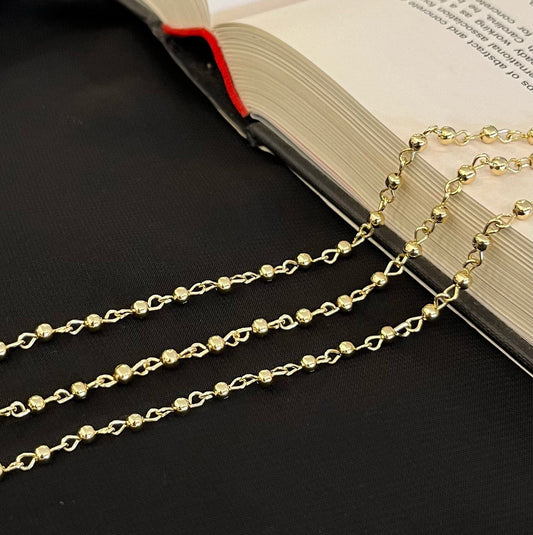 Gold filled beaded chain close-up showing detailed texture and golden finish
