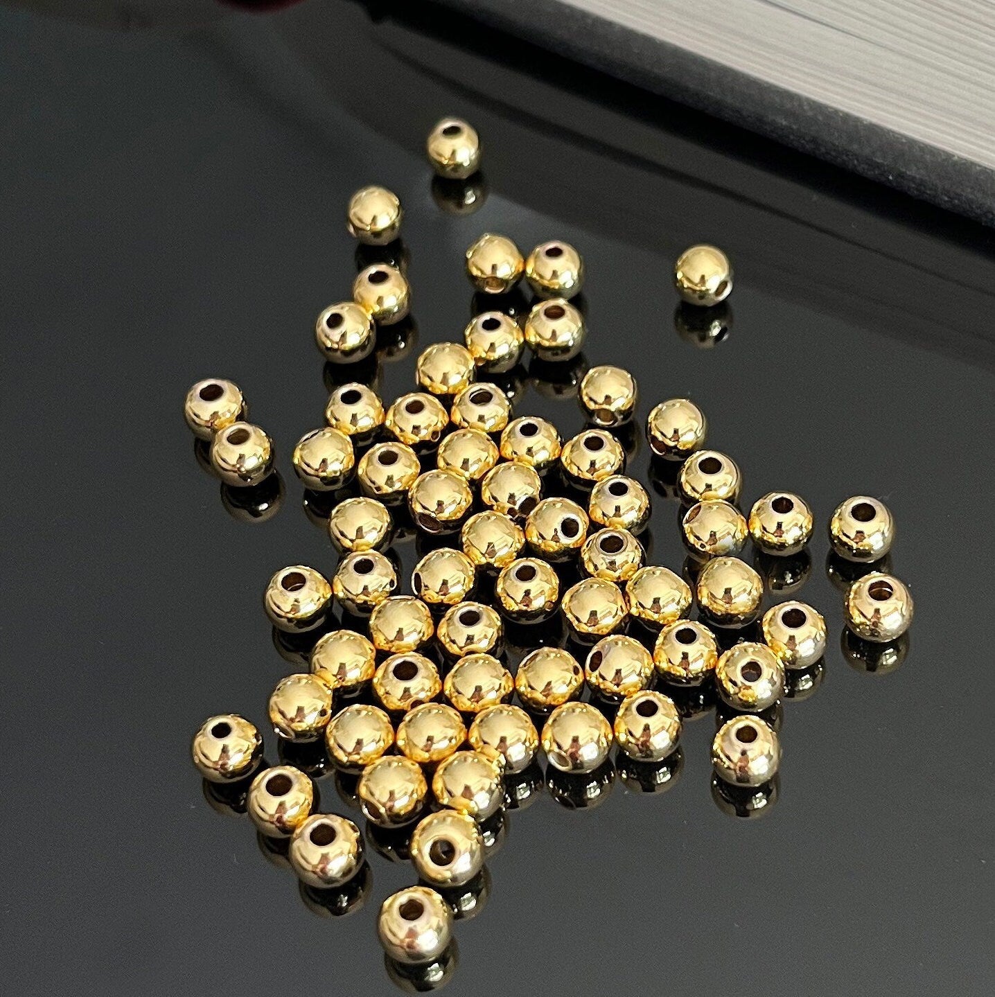 Gold filled seamless spacer beads close-up detail smooth finish