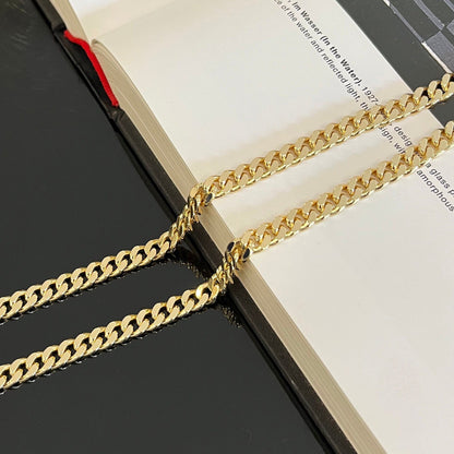 gold filled 7mm curb chain on white background