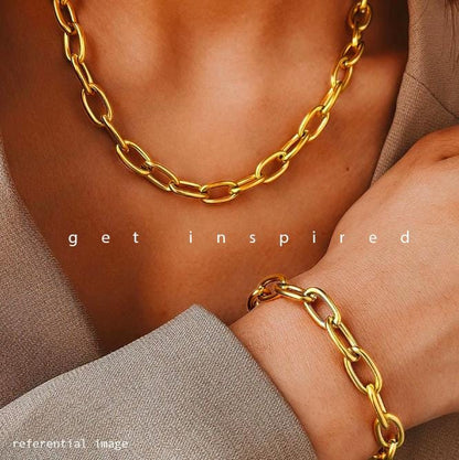 Woman wearing a thick gold chain and a thick link bracelet